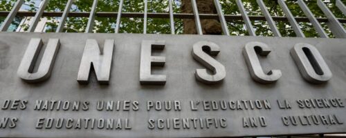Paris, France - July 4, 2023: Sign outside the headquarters of UNESCO, an international institution of the United Nations specialized in education, science and culture