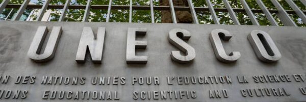 Paris, France - July 4, 2023: Sign outside the headquarters of UNESCO, an international institution of the United Nations specialized in education, science and culture